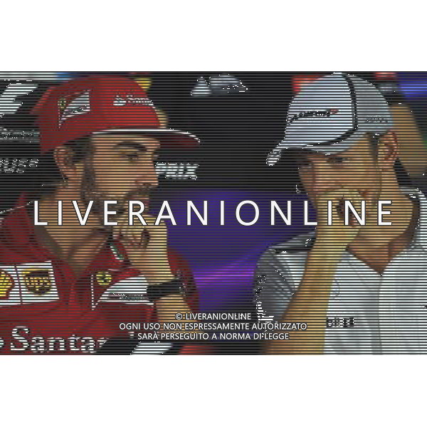 (L to R): Fernando Alonso (ESP) Ferrari and Jenson Button (GBR) McLaren in the FIA Press Conference. 09.10.2014. Formula 1 World Championship, Rd 16, Russian Grand Prix, Sochi Autodrom, Sochi, Russia, Preparation Day. - www.xpbimages.com, EMail: requests@xpbimages.com - copy of publication required for printed pictures. Every used picture is fee-liable. © Copyright: Photo4 / XPB Images