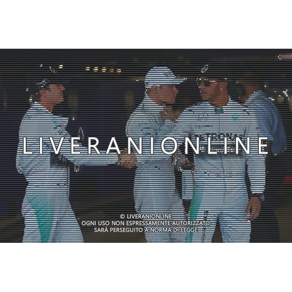 (L to R): Nico Rosberg (GER) Mercedes AMG F1 congratulates team mate and pole sitter Lewis Hamilton (GBR) Mercedes AMG F1 in parc ferme. 11.10.2014. Formula 1 World Championship, Rd 16, Russian Grand Prix, Sochi Autodrom, Sochi, Russia, Qualifying Day. Ag ALDO LIVERANI SAS ONLY ITALY