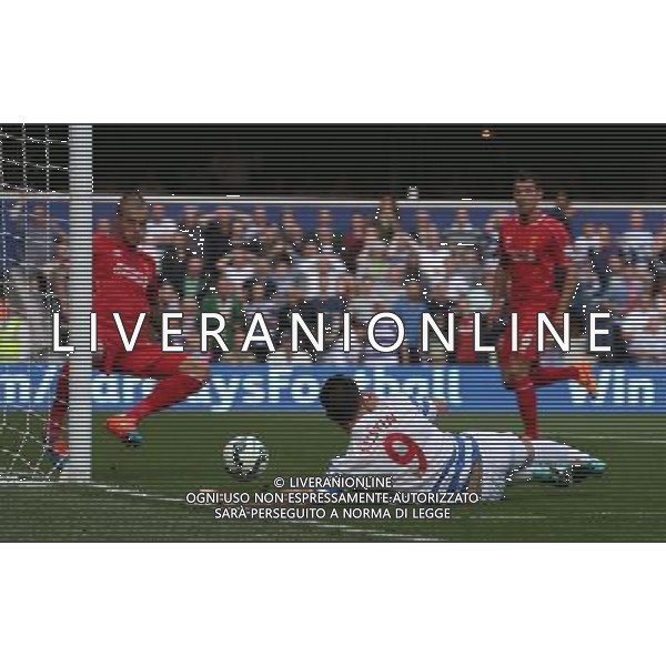 Queens Park Rangers\' Charlie Austin despite the attentions of Liverpool\'s Martin Skrtel Photographer Kieran Galvin/CameraSport Football - Barclays Premiership - Queens Park Rangers v Liverpool - Sunday 19th October 2014 - Loftus Road - London © CameraSport - 43 Linden Ave. Countesthorpe. Leicester. England. LE8 5PG - Tel: +44 (0) 116 277 4147 - admin@camerasport.com - www.camerasport.com /AGENZIA ALDO LIVERANI SAS - ITALY ONLY - EDITORIAL USE ONLY