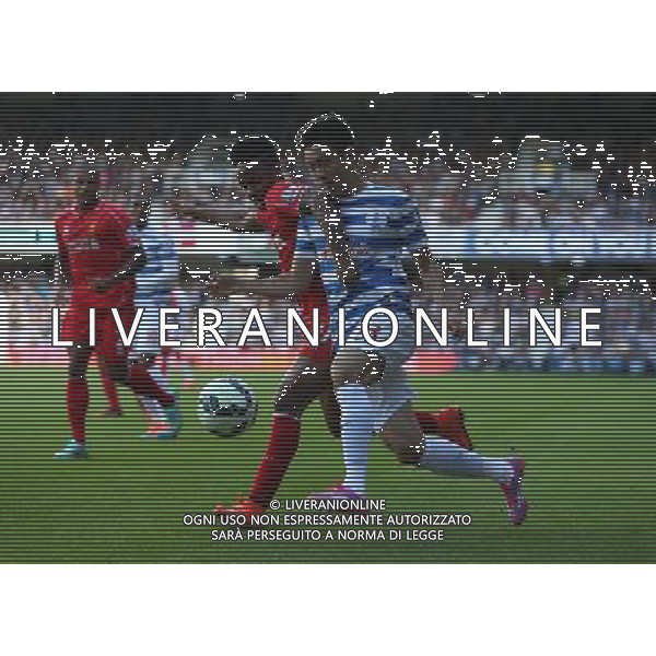 Queens Park Rangers\' Yoon Suk-Young despite the attentions of Liverpool\'s Raheem Sterling Photographer Kieran Galvin/CameraSport Football - Barclays Premiership - Queens Park Rangers v Liverpool - Sunday 19th October 2014 - Loftus Road - London © CameraSport - 43 Linden Ave. Countesthorpe. Leicester. England. LE8 5PG - Tel: +44 (0) 116 277 4147 - admin@camerasport.com - www.camerasport.com /AGENZIA ALDO LIVERANI SAS - ITALY ONLY - EDITORIAL USE ONLY