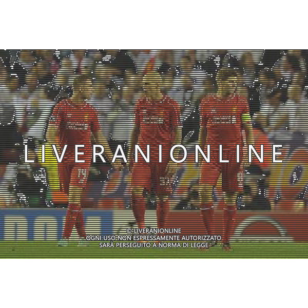 What\'s going wrong think Liverpool\'s Jordan Henderson Martin Skrtel and Steven Gerrard Photographer Dave Howarth/CameraSport Football - UEFA Champions League Group B - Liverpool v Real Madrid - Wednesday 22nd October 2014 - Anfield - Liverpool © CameraSport - 43 Linden Ave. Countesthorpe. Leicester. England. LE8 5PG - Tel: +44 (0) 116 277 4147 - admin@camerasport.com - www.camerasport.com AG ALDO LIVERANI SAS ONLY ITALY