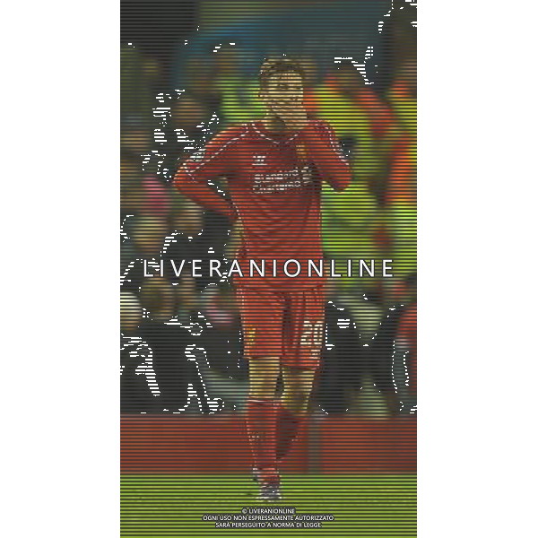 A dejected Liverpool\'s Adam Lallana Photographer Dave Howarth/CameraSport Football - UEFA Champions League Group B - Liverpool v Real Madrid - Wednesday 22nd October 2014 - Anfield - Liverpool © CameraSport - 43 Linden Ave. Countesthorpe. Leicester. England. LE8 5PG - Tel: +44 (0) 116 277 4147 - admin@camerasport.com - www.camerasport.com /Agenzia Aldo Liverani sas - ITALY ONLY - EDITORIAL USE ONLY