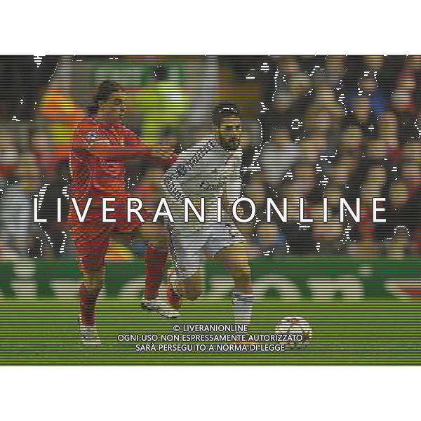 Real Madrid\'s Isco is tackled by Liverpool\'s Lazar Markovic Photographer Dave Howarth/CameraSport Football - UEFA Champions League Group B - Liverpool v Real Madrid - Wednesday 22nd October 2014 - Anfield - Liverpool © CameraSport - 43 Linden Ave. Countesthorpe. Leicester. England. LE8 5PG - Tel: +44 (0) 116 277 4147 - admin@camerasport.com - www.camerasport.com /Agenzia Aldo Liverani sas - ITALY ONLY - EDITORIAL USE ONLY