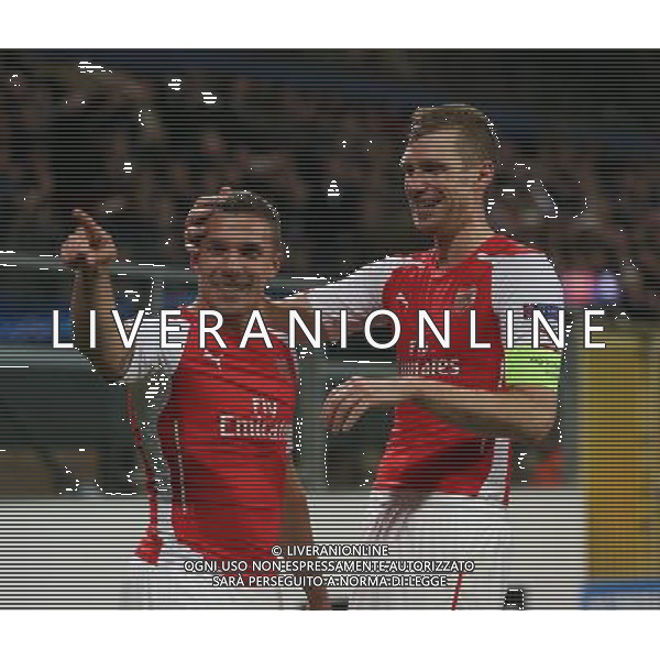 Arsenal\'s Lukas Podolski celebrates his goal Photographer Kieran Galvin/CameraSport Football - UEFA Champions League Group D - Anderlecht v Arsenal - Wednesday 22 October 2014 - Constant Vanden Stockstadion - Brussels - Belgium © CameraSport - 43 Linden Ave. Countesthorpe. Leicester. England. LE8 5PG - Tel: +44 (0) 116 277 4147 - admin@camerasport.com - www.camerasport.com /Agenzia Aldo Liverani sas - ITALY ONLY - EDITORIAL USE ONLY