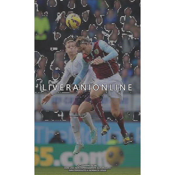 Burnley\'s Michael Duff and Everton\'s Ross Barkley jump for the ball Photographer Dave Howarth/CameraSport Football - Barclays Premiership - Burnley v Everton - Sunday 26th October - Turf Moor - Burnley © CameraSport - 43 Linden Ave. Countesthorpe. Leicester. England. LE8 5PG - Tel: +44 (0) 116 277 4147 - admin@camerasport.com - www.camerasport.com AG ALDO LIVERANI SAS ONLY ITALY