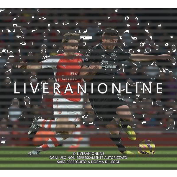 Burnley\'s Lukas Jutkiewicz battles with Arsenal\'s Nacho Monreal Photographer Ian Cook/CameraSport Football - Barclays Premiership - Arsenal v Burnley - Saturday 1st November 2014 - Emirates Stadium - London © CameraSport - 43 Linden Ave. Countesthorpe. Leicester. England. LE8 5PG - Tel: +44 (0) 116 277 4147 - admin@camerasport.com - www.camerasport.com AG ALDO LIVERANI SAS ONLY ITALY