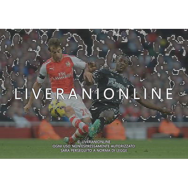 Burnley\'s Marvin Sordell battles with Arsenal\'s Mathieu Flamini Photographer Ian Cook/CameraSport Football - Barclays Premiership - Arsenal v Burnley - Saturday 1st November 2014 - Emirates Stadium - London © CameraSport - 43 Linden Ave. Countesthorpe. Leicester. England. LE8 5PG - Tel: +44 (0) 116 277 4147 - admin@camerasport.com - www.camerasport.com AG ALDO LIVERANI SAS ONLY ITALY