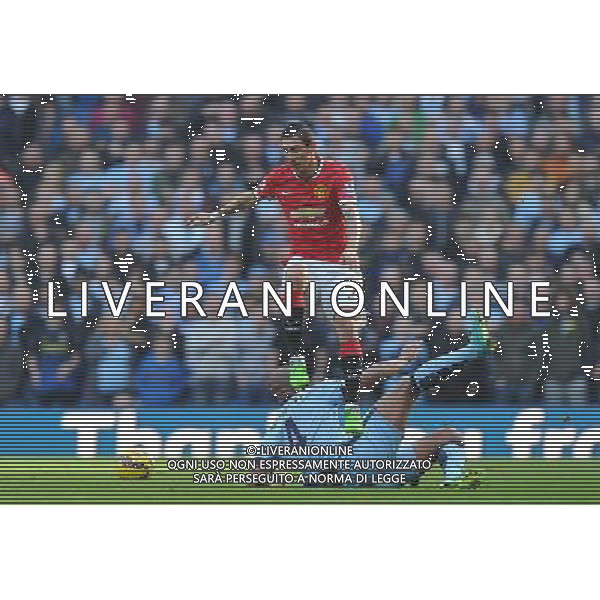 Manchester United\'s çngel Di Maria leaps over the tackle of Manchester City\'s Vincent Kompany Photographer Dave Howarth/CameraSport Football - Barclays Premiership - Manchester City v Manchester United - Sunday 2nd November 2014 - Etihad Stdium - Manchester © CameraSport - 43 Linden Ave. Countesthorpe. Leicester. England. LE8 5PG - Tel: +44 (0) 116 277 4147 - admin@camerasport.com - www.camerasport.com AG ALDO LIVERANI SAS ONLY ITALY