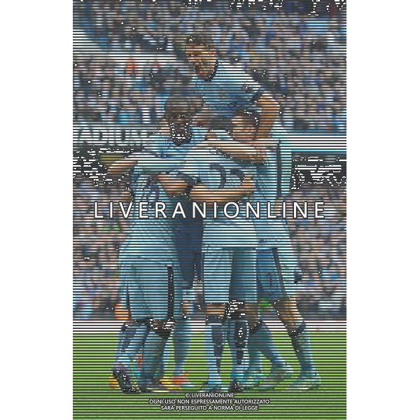 Manchester City\'s Sergio AgŸero is mobbed by team mates after scoring his team\'s first goal Photographer Dave Howarth/CameraSport Football - Barclays Premiership - Manchester City v Manchester United - Sunday 2nd November 2014 - Etihad Stdium - Manchester © CameraSport - 43 Linden Ave. Countesthorpe. Leicester. England. LE8 5PG - Tel: +44 (0) 116 277 4147 - admin@camerasport.com - www.camerasport.com AG ALDO LIVERANI SAS ONLY ITALY