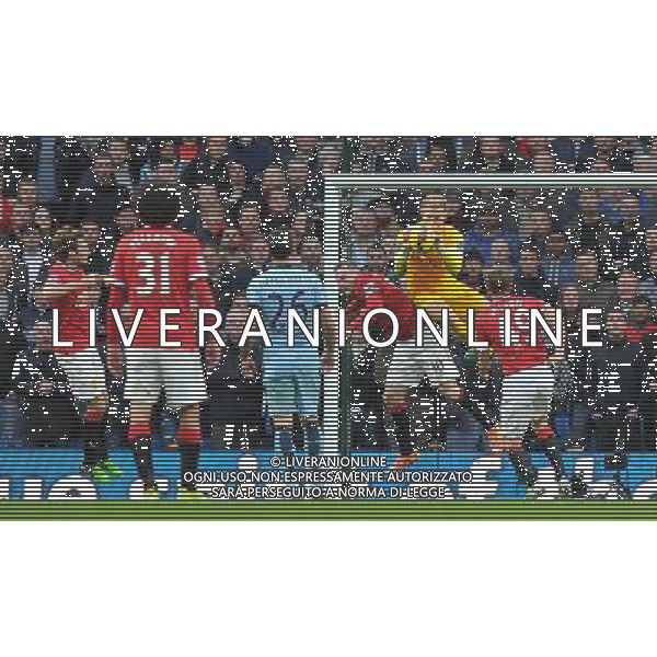 Manchester City\'s Joe Hart and Manchester United\'s Wayne Rooney collide in the goal mouth Photographer Dave Howarth/CameraSport Football - Barclays Premiership - Manchester City v Manchester United - Sunday 2nd November 2014 - Etihad Stdium - Manchester © CameraSport - 43 Linden Ave. Countesthorpe. Leicester. England. LE8 5PG - Tel: +44 (0) 116 277 4147 - admin@camerasport.com - www.camerasport.com AG ALDO LIVERANI SAS ONLY ITALY