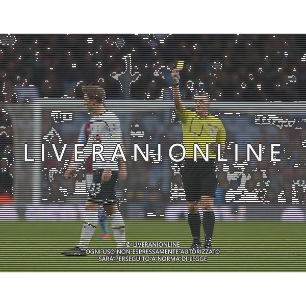 Tottenham Hotspur\'s Christian Eriksen is shown a yellow card by Referee Neil Swarbrick Photographer Kieran Galvin/CameraSport Football - Barclays Premiership - Aston Villa v Tottenham Hotspur - Sunday 2nd November 2014 - Villa Park - Birmingham © CameraSport - 43 Linden Ave. Countesthorpe. Leicester. England. LE8 5PG - Tel: +44 (0) 116 277 4147 - admin@camerasport.com - www.camerasport.com AG ALDO LIVERANI SAS ONLY ITALY