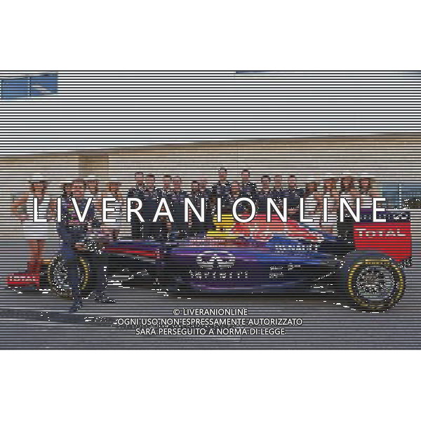 Sebastian Vettel (GER) Red Bull Racing at a team photograph with his crew and grid girls. 02.11.2014. Formula 1 World Championship, Rd 17, United States Grand Prix, Austin, Texas, USA, Race Day. AG ALDO LIVERANI SAS ONLY ITALY