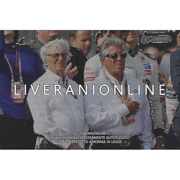 (L to R): Bernie Ecclestone (GBR) with Mario Andretti (USA) Circuit of The Americas\' Official Ambassador on the grid. 02.11.2014. Formula 1 World Championship, Rd 17, United States Grand Prix, Austin, Texas, USA, Race Day. AG ALDO LIVERANI SAS ONLY ITALY