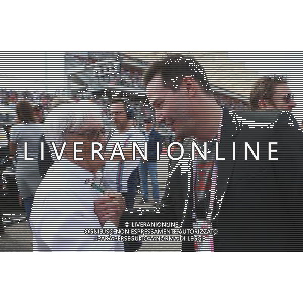 (L to R): Bernie Ecclestone (GBR) with Keanu Reeves (USA) Actor on the grid. 02.11.2014. Formula 1 World Championship, Rd 17, United States Grand Prix, Austin, Texas, USA, Race Day. AG ALDO LIVERANI SAS ONLY ITALY