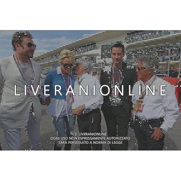(L to R): Simon Le Bon (GBR) Duran Duran Lead Singer with Pamela Anderson (USA) Actress; Bernie Ecclestone (GBR); Keanu Reeves (USA) Actor; and Mario Andretti (USA) Circuit of The Americas\' Official Ambassador on the grid. 02.11.2014. Formula 1 World Championship, Rd 17, United States Grand Prix, Austin, Texas, USA, Race Day. AG ALDO LIVERANI SAS ONLY ITALY