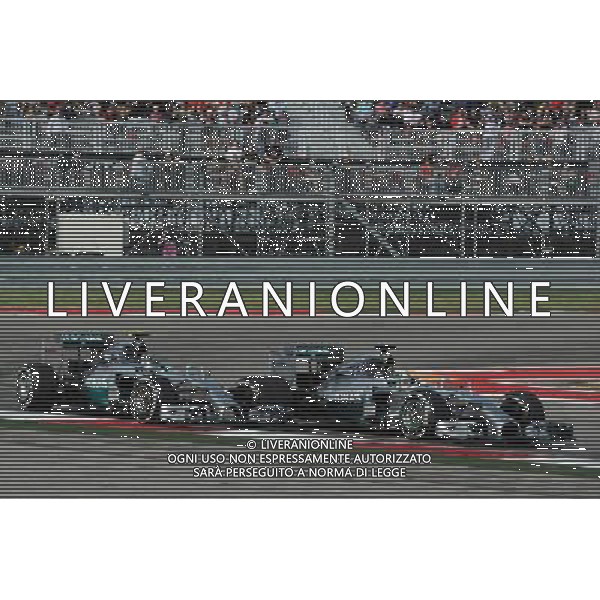 Lewis Hamilton (GBR) Mercedes AMG F1 W05 passes team mate Nico Rosberg (GER) Mercedes AMG F1 W05 to take the lead of the race. 02.11.2014. Formula 1 World Championship, Rd 17, United States Grand Prix, Austin, Texas, USA, Race Day. /AGENZIA ALDO LIVERANI SAS - ITALY ONLY - EDITORIAL USE ONLY
