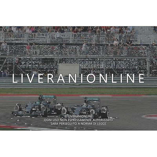 Lewis Hamilton (GBR) Mercedes AMG F1 W05 passes team mate Nico Rosberg (GER) Mercedes AMG F1 W05 to take the lead of the race. 02.11.2014. Formula 1 World Championship, Rd 17, /AGENZIA ALDO LIVERANI SAS - ITALY ONLY - EDITORIAL USE ONLY