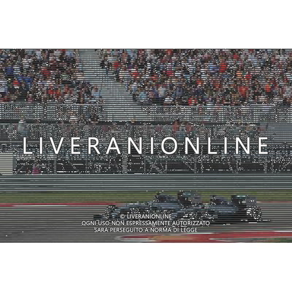 Lewis Hamilton (GBR) Mercedes AMG F1 W05 passes team mate Nico Rosberg (GER) Mercedes AMG F1 W05 to take the lead of the race. /AGENZIA ALDO LIVERANI SAS - ITALY ONLY - EDITORIAL USE ONLY