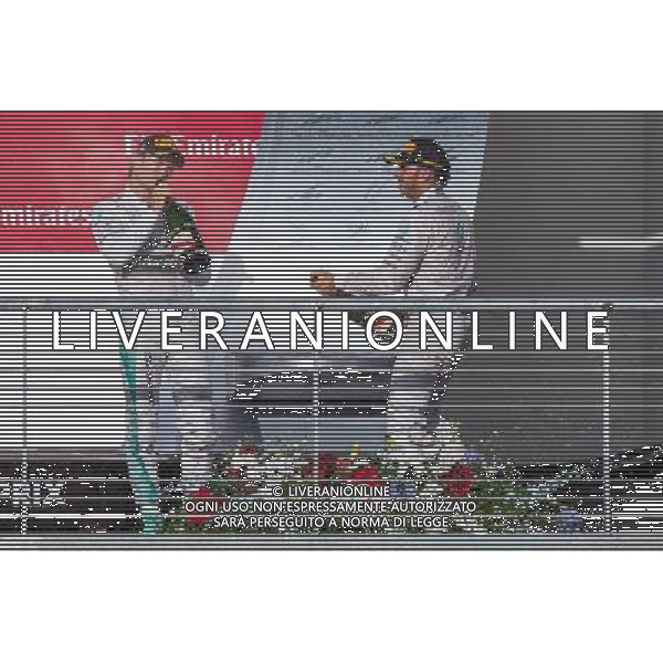 Race winner Lewis Hamilton (GBR) Mercedes AMG F1 (Right) celebrates with team mate Nico Rosberg (GER) Mercedes AMG F1 on the podium. 02.11.2014. Formula 1 World Championship, Rd 17, United States Grand Prix, Austin, Texas, USA, Race Day. AG ALDO LIVERANI SAS ONLY ITALY