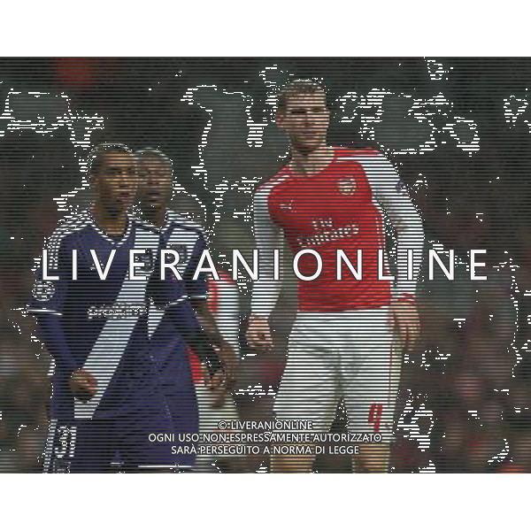 Arsenal\'s Per Mertesacker in action during todays match Photographer Kieran Galvin/CameraSport Football - UEFA Champions League Group D - Arsenal v Anderlecht - Tuesday 4th November 2014 - Emirates Stadium - London © CameraSport - 43 Linden Ave. Countesthorpe. Leicester. England. LE8 5PG - Tel: +44 (0) 116 277 4147 - admin@camerasport.com - www.camerasport.com /Agenzia Aldo Liverani sas - ITALY ONLY - EDITORIAL USE ONLY