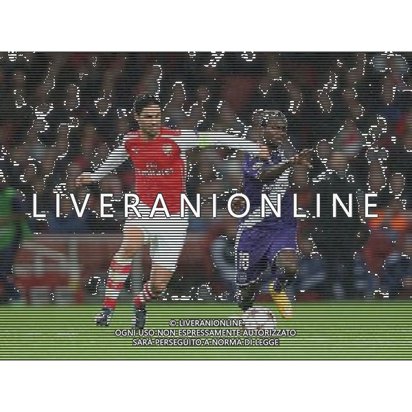 Anderlecht\'s Frank Acheampong under pressure from Arsenal\'s Mikel Arteta Photographer Kieran Galvin/CameraSport Football - UEFA Champions League Group D - Arsenal v Anderlecht - Tuesday 4th November 2014 - Emirates Stadium - London © CameraSport - 43 Linden Ave. Countesthorpe. Leicester. England. LE8 5PG - Tel: +44 (0) 116 277 4147 - admin@camerasport.com - www.camerasport.com /Agenzia Aldo Liverani sas - ITALY ONLY - EDITORIAL USE ONLY
