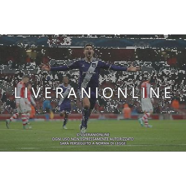 Anderlecht\'s Aleksandar Mitrovic celebrates scoring his sides equalising goal to make the score 3-3 in the last minute of the match to recover from being 3-0 down Photographer Kieran Galvin/CameraSport Football - UEFA Champions League Group D - Arsenal v Anderlecht - Tuesday 4th November 2014 - Emirates Stadium - London å© CameraSport - 43 Linden Ave. Countesthorpe. Leicester. England. LE8 5PG - Tel: +44 (0) 116 277 4147 - admin@camerasport.com - www.camerasport.com