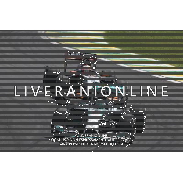 Nico Rosberg (GER) Mercedes AMG F1 W05 leads Nico Hulkenberg (GER) Sahara Force India F1 VJM07. 09.11.2014. Formula 1 World Championship, Rd 18, Brazilian Grand Prix, Sao Paulo, Brazil, Race Day. - www.xpbimages.com, EMail: requests@xpbimages.com - copy of publication required for printed pictures. Every used picture is fee-liable. © Copyright: Photo4 / XPB Images /AGENZIA ALDO LIVERANI SAS - ITALY ONLY - EDITORIAL USE ONLY - Grand Prix Gp F1 Brasile gara