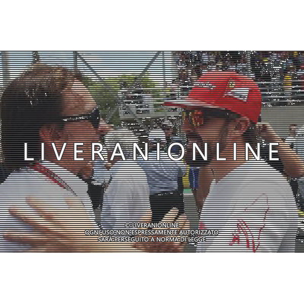 (L to R): Emerson Fittipaldi (BRA) with Fernando Alonso (ESP) Ferrari on the grid. 09.11.2014. Formula 1 World Championship, Rd 18, Brazilian Grand Prix, Sao Paulo, Brazil, Race Day. - www.xpbimages.com, EMail: requests@xpbimages.com - copy of publication required for printed pictures. Every used picture is fee-liable. © Copyright: Photo4 / XPB Images /AGENZIA ALDO LIVERANI SAS - ITALY ONLY - EDITORIAL USE ONLY - Grand Prix Gp F1 Brasile gara
