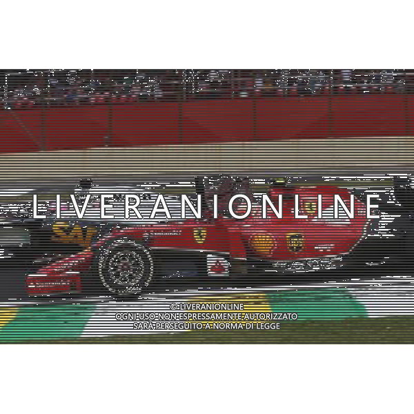 Jenson Button (GBR) McLaren MP4-29 and Kimi Raikkonen (FIN). 09.11.2014. Formula 1 World Championship, Rd 18, Brazilian Grand Prix, Sao Paulo, Brazil, Race Day. AG ALDO LIVERANI SAS ONLY ITALY