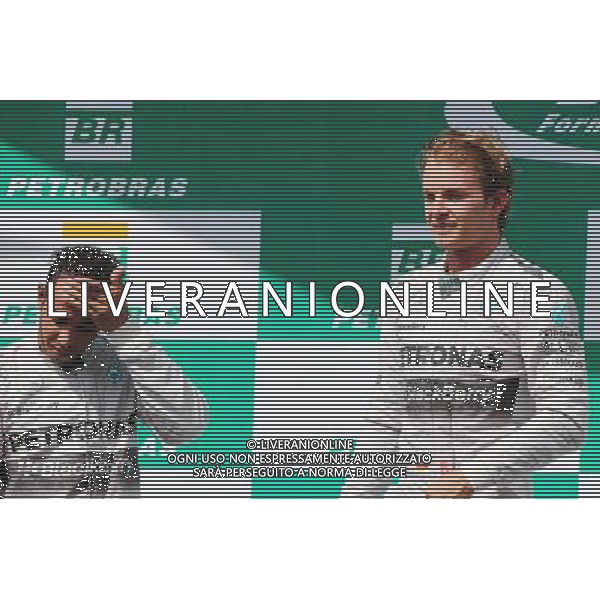 The podium (L to R): second placed Lewis Hamilton (GBR) Mercedes AMG F1 with race winner and team mate Nico Rosberg (GER) Mercedes AMG F1. 09.11.2014. Formula 1 World Championship, Rd 18, Brazilian Grand Prix, Sao Paulo, Brazil, Race Day. AG ALDO LIVERANI SAS ONLY ITALY