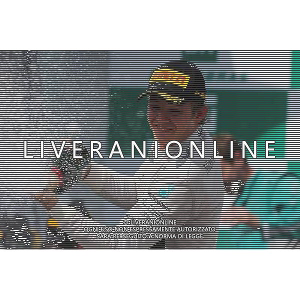 Race winner Nico Rosberg (GER) Mercedes AMG F1 celebrates on the podium. 09.11.2014. Formula 1 World Championship, Rd 18, Brazilian Grand Prix, Sao Paulo, Brazil, Race Day. AG ALDO LIVERANI SAS ONLY ITALY