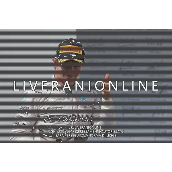Race winner Nico Rosberg (GER) Mercedes AMG F1 celebrates on the podium. 09.11.2014. Formula 1 World Championship, Rd 18, Brazilian Grand Prix, Sao Paulo, Brazil, Race Day. AG ALDO LIVERANI SAS ONLY ITALY