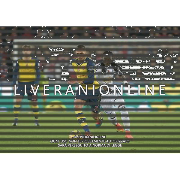 Arsenal\'s Kieran Gibbs gets away from Swansea City\'s Marvin Emnes Photographer Ian Cook/CameraSport Football - Barclays Premiership - Swansea City v Arsenal - Sunday 9th November 2014 - Liberty Stadium - Swansea © CameraSport - 43 Linden Ave. Countesthorpe. Leicester. England. LE8 5PG - Tel: +44 (0) 116 277 4147 - admin@camerasport.com - www.camerasport.com AG ALDO LIVERANI SAS ONLY ITALY