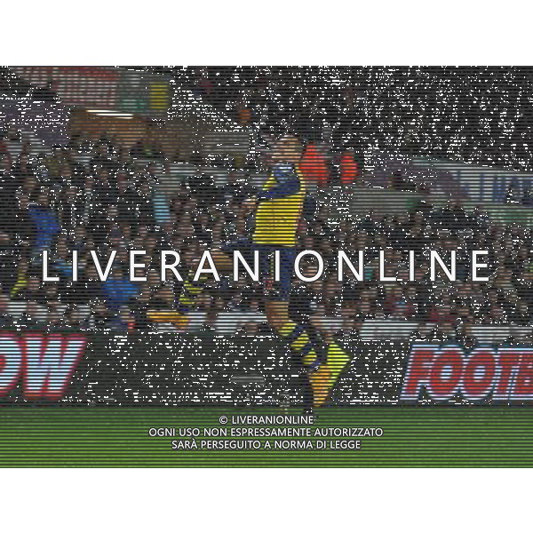 Arsenal\'s Alexis S‡nchez celebrates scoring his sides first goal Photographer Ian Cook/CameraSport Football - Barclays Premiership - Swansea City v Arsenal - Sunday 9th November 2014 - Liberty Stadium - Swansea © CameraSport - 43 Linden Ave. Countesthorpe. Leicester. England. LE8 5PG - Tel: +44 (0) 116 277 4147 - admin@camerasport.com - www.camerasport.com AG ALDO LIVERANI SAS ONLY ITALY