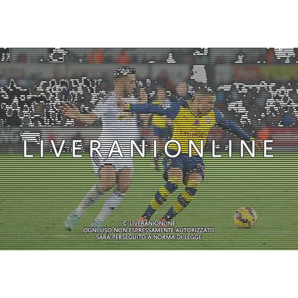 Arsenal\'s Alex Oxlade-Chamberlain battles with Swansea City\'s Neil Taylor Photographer Ian Cook/CameraSport Football - Barclays Premiership - Swansea City v Arsenal - Sunday 9th November 2014 - Liberty Stadium - Swansea © CameraSport - 43 Linden Ave. Countesthorpe. Leicester. England. LE8 5PG - Tel: +44 (0) 116 277 4147 - admin@camerasport.com - www.camerasport.com AG ALDO LIVERANI SAS ONLY ITALY