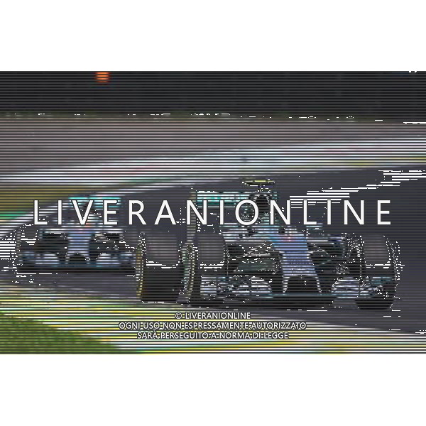 Nico Rosberg (GER) Mercedes AMG F1 W05 leads Lewis Hamilton (GBR) Mercedes AMG F1 W05. 09.11.2014. Formula 1 World Championship, Rd 18, Brazilian Grand Prix, Sao Paulo, Brazil, Race Day. AG ALDO LIVERANI SAS ONLY ITALY