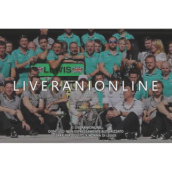 Race winner Nico Rosberg (GER) Mercedes AMG F1 celebrates with second placed Lewis Hamilton (GBR) Mercedes AMG F1 and the team. 09.11.2014. Formula 1 World Championship, Rd 18, Brazilian Grand Prix, Sao Paulo, Brazil, Race Day. AG ALDO LIVERANI SAS ONLY ITALY