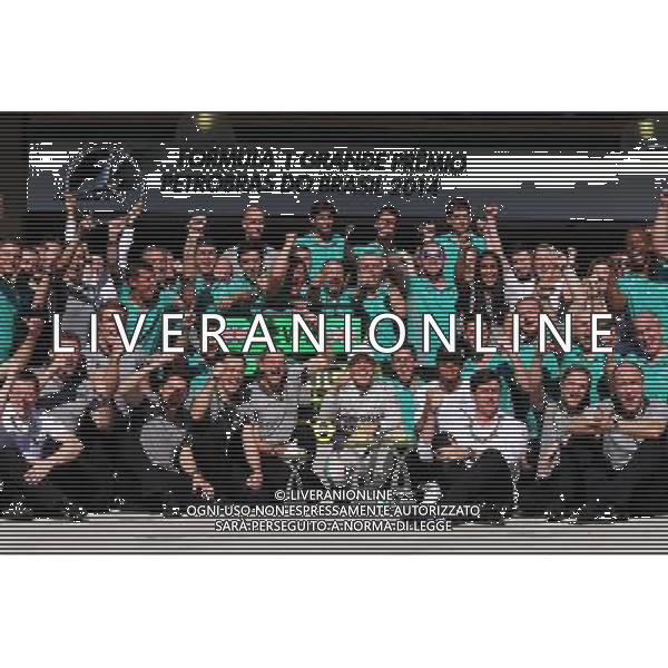 Race winner Nico Rosberg (GER) Mercedes AMG F1 celebrates with second placed Lewis Hamilton (GBR) Mercedes AMG F1 and the team. 09.11.2014. Formula 1 World Championship, Rd 18, Brazilian Grand Prix, Sao Paulo, Brazil, Race Day. AG ALDO LIVERANI SAS ONLY ITALY