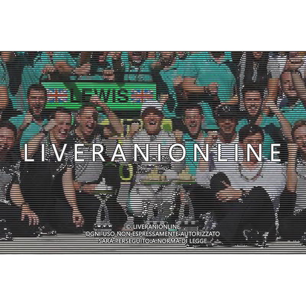 Race winner Nico Rosberg (GER) Mercedes AMG F1 celebrates with second placed Lewis Hamilton (GBR) Mercedes AMG F1 and the team. 09.11.2014. Formula 1 World Championship, Rd 18, Brazilian Grand Prix, Sao Paulo, Brazil, Race Day. AG ALDO LIVERANI SAS ONLY ITALY