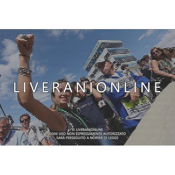 Rafaela Bassi (BRA) and son Felipinho Massa (BRA) celebrate at the end of the race. 09.11.2014. Formula 1 World Championship, Rd 18, Brazilian Grand Prix, Sao Paulo, Brazil, Race Day. AG ALDO LIVERANI SAS ONLY ITALY