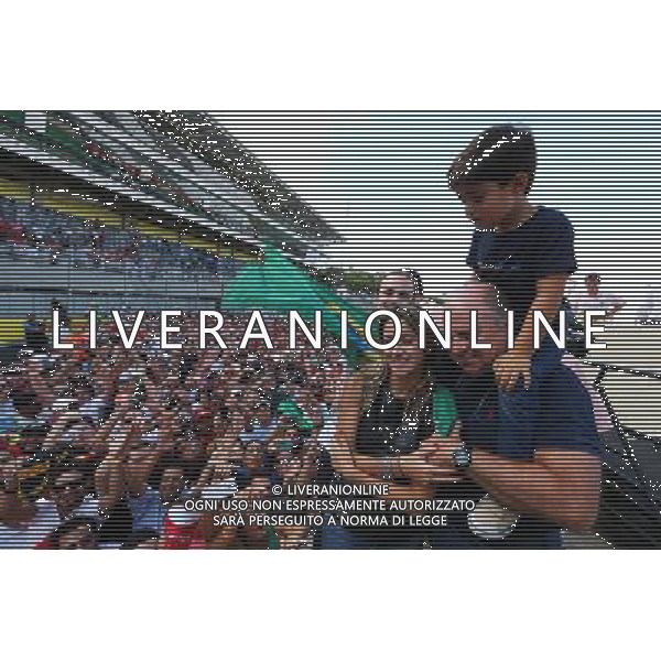 Rafaela Bassi (BRA), with son Felipinho Massa (BRA) and Luis Antonio Massa (BRA), father of Felipe Massa (BRA) Williams, at the end of the race. 09.11.2014. Formula 1 World Championship, Rd 18, Brazilian Grand Prix, Sao Paulo, Brazil, Race Day. AG ALDO LIVERANI SAS ONLY ITALY