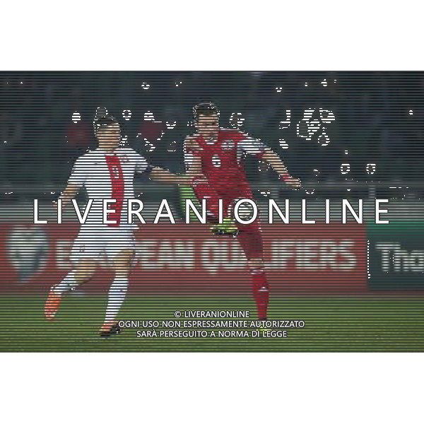 TBILISI 14.11.2014 MECZ ELIMINACJE DO MISTRZOSTW EUROPY FRANCJA 2016 GRUPA D: GRUZJA - POLSKA --- QUALIFICATION FOR UEFA EURO 2016 MATCH GROUP D: GEORGIA - POLAND ROBERT LEWANDOWSKI AKAKI KHUBUTIA FOT. PIOTR KUCZA/NEWSPIX.PL --- Newspix.pl /Agenzia Aldo Liverani sas - ITALY ONLY - EDITORIAL USE ONLY - Georgia - Polonia qualificazioni Europei UEFA del 2016 *** Local Caption *** www.newspix.pl mail us: info@newspix.pl call us: 0048 022 23 22 222 --- Polish Picture Agency by Ringier Axel Springer Poland