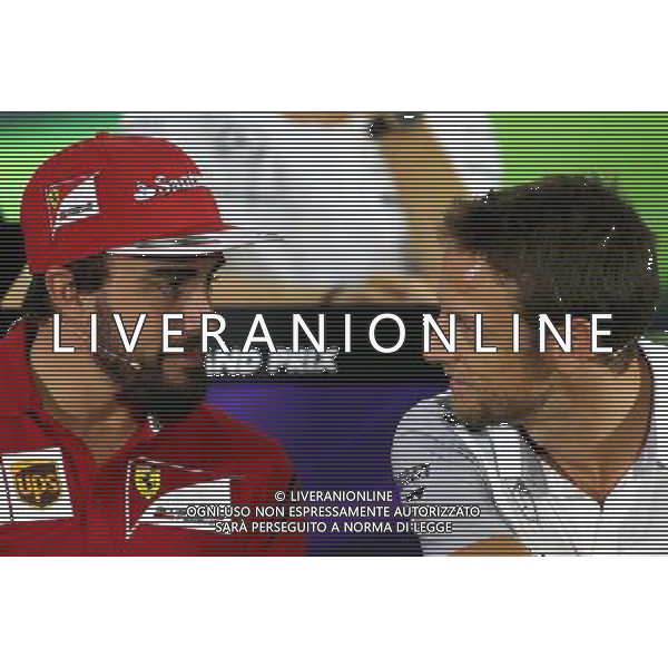 Fernando Alonso (ESP), Scuderia Ferrari and Jenson Button (GBR), McLaren F1 Team 20.11.2014. Formula 1 World Championship, Rd 19, Abu Dhabi Grand Prix, Yas Marina Circuit, Abu Dhabi, Preparation Day. AG ALDO LIVERANI SAS ONLY ITALY