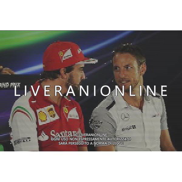 (L to R): Fernando Alonso (ESP) Ferrari and Jenson Button (GBR) McLaren in the FIA Press Conference. 20.11.2014. Formula 1 World Championship, Rd 19, Abu Dhabi Grand Prix, Yas Marina Circuit, Abu Dhabi, Preparation Day. AG ALDO LIVERANI SAS ONLY ITALY