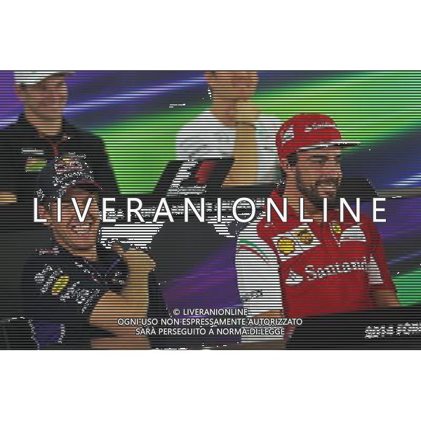 (L to R): Sebastian Vettel (GER) Red Bull Racing with Fernando Alonso (ESP) Ferrari in the FIA Press Conference. 20.11.2014. Formula 1 World Championship, Rd 19, Abu Dhabi Grand Prix, Yas Marina Circuit, Abu Dhabi, Preparation Day. AG ALDO LIVERANI SAS ONLY ITALY
