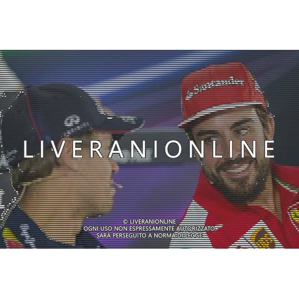 (L to R): Sebastian Vettel (GER) Red Bull Racing with Fernando Alonso (ESP) Ferrari in the FIA Press Conference. 20.11.2014. Formula 1 World Championship, Rd 19, Abu Dhabi Grand Prix, Yas Marina Circuit, Abu Dhabi, Preparation Day. AG ALDO LIVERANI SAS ONLY ITALY