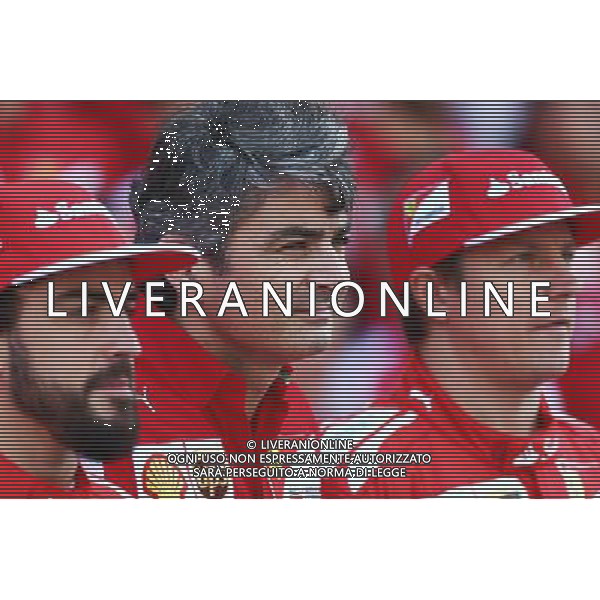 (L to R): Fernando Alonso (ESP) Ferrari with Marco Mattiacci (ITA) Ferrari Team Principal and Kimi Raikkonen (FIN) Ferrari at a team photograph. 21.11.2014. Formula 1 World Championship, Rd 19, Abu Dhabi Grand Prix, Yas Marina Circuit, Abu Dhabi, Practice Day. AG ALDO LIVERANI SAS ONLY ITALY