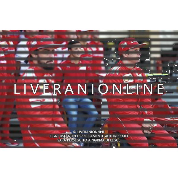 (L to R): Fernando Alonso (ESP) Ferrari and team mate Kimi Raikkonen (FIN) Ferrari at a team photograph. 21.11.2014. Formula 1 World Championship, Rd 19, Abu Dhabi Grand Prix, Yas Marina Circuit, Abu Dhabi, Practice Day. AG ALDO LIVERANI SAS ONLY ITALY