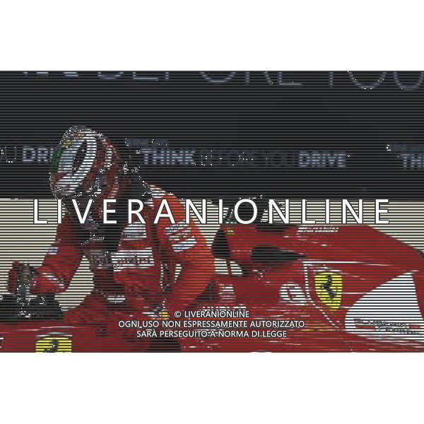 Fernando Alonso (ESP) Ferrari F14-T in parc ferme. 22.11.2014. Formula 1 World Championship, Rd 19, Abu Dhabi Grand Prix, Yas Marina Circuit, Abu Dhabi, Qualifying Day. AG ALDO LIVERANI SAS ONLY ITALY