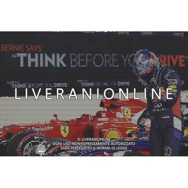 Sebastian Vettel (GER) Red Bull Racing RB10 with a message of thanks on his helmet. 22.11.2014. Formula 1 World Championship, Rd 19, Abu Dhabi Grand Prix, Yas Marina Circuit, Abu Dhabi, Qualifying Day. AG ALDO LIVERANI SAS ONLY ITALY
